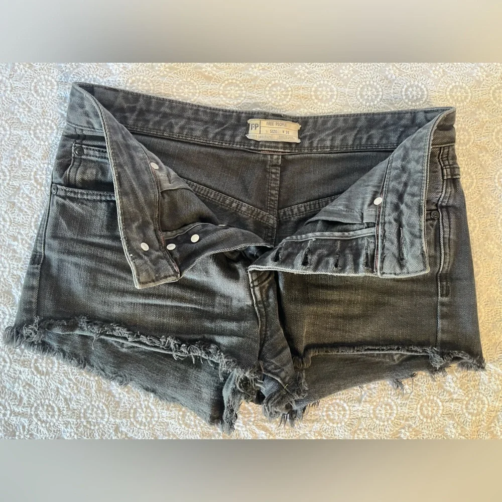 Free People black cut-off shorts, size 25; distressed black denim with raw hem
